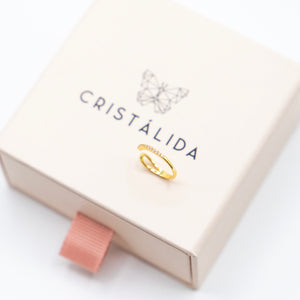 Imagen de Piercing plata color oro sobre packaging de joyeria